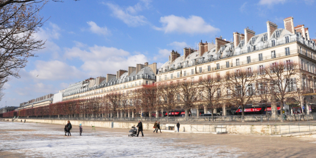Couple walk in Paris.