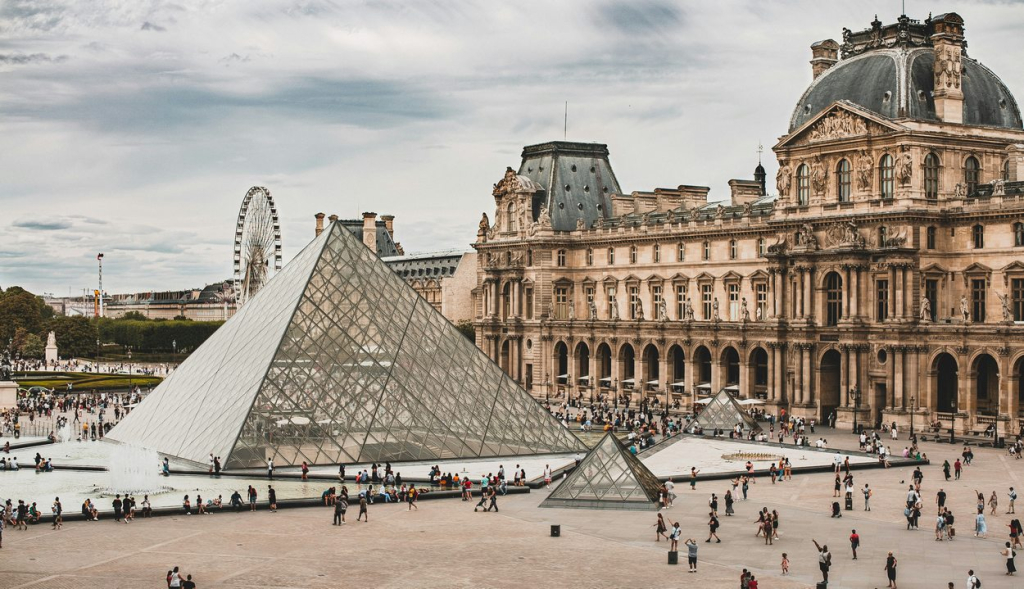 The Louvre museum and its pyramid in Paris